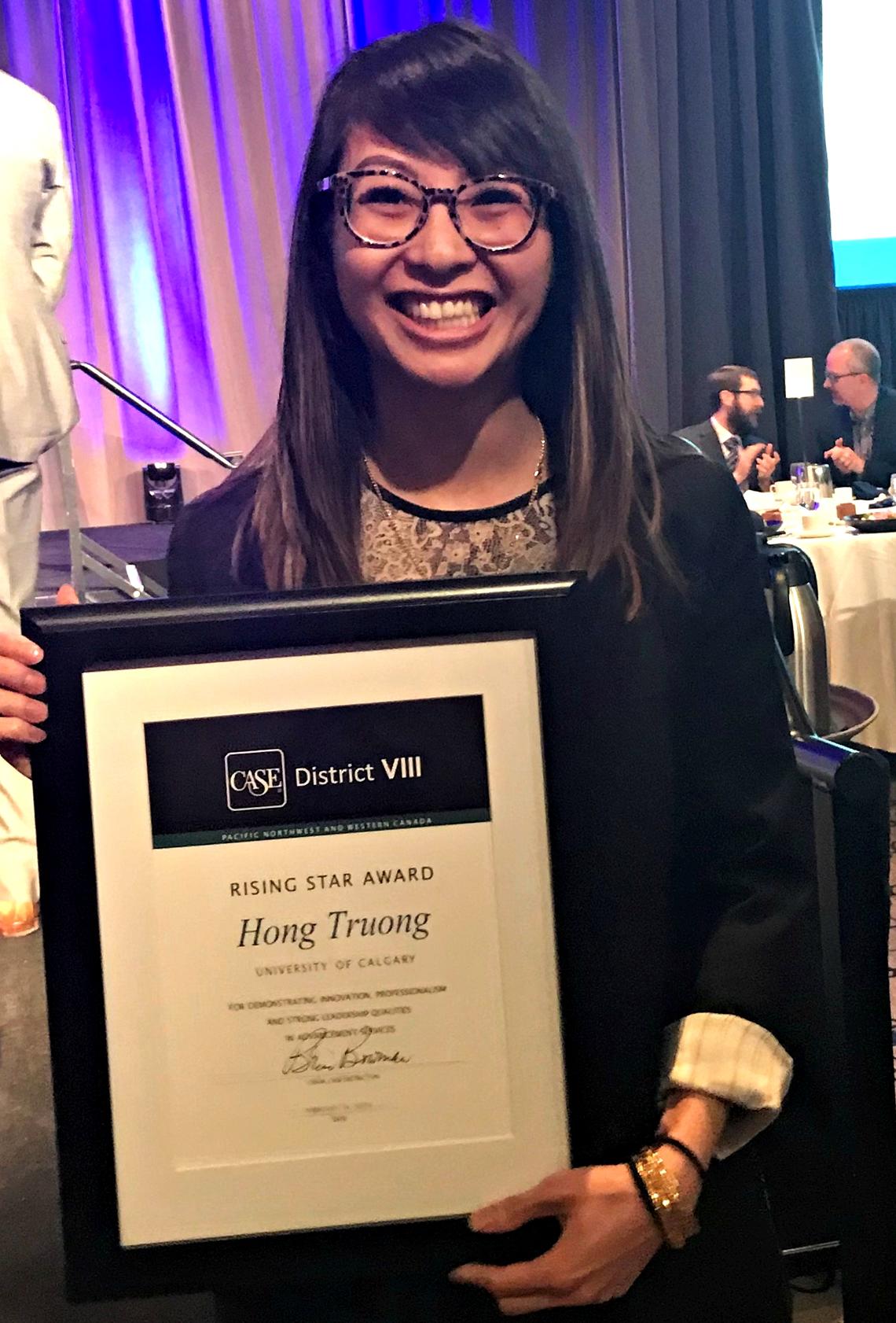 Hong Truong, event data co-ordinator for Development and Alumni Engagement, is all smiles at the CASE awards lunch on Feb. 14, 2019, after winning the Rising Star Award.