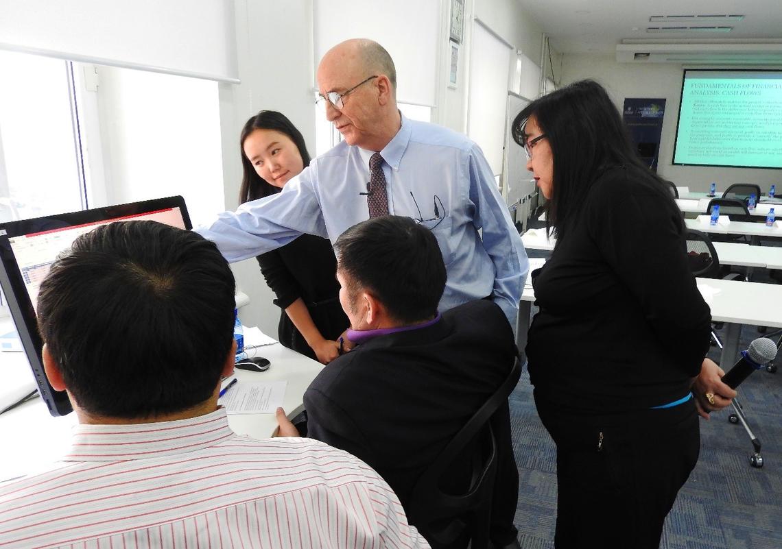 Bev Dahlby offers expertise during a break-out session during the training program for Mongolian government officials. 