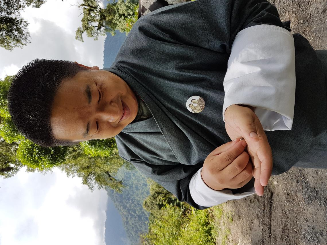 Namgyal holds a tick collected as part of his research.