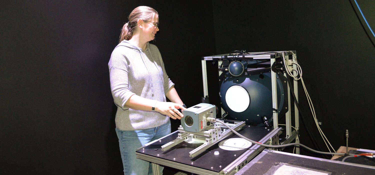 A woman works on a machine