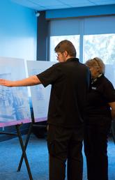 University of Calgary campus community members browse information at the November 2018 open house.