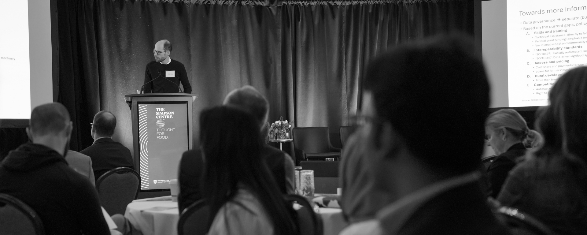Wide shot of a presenter at a conference