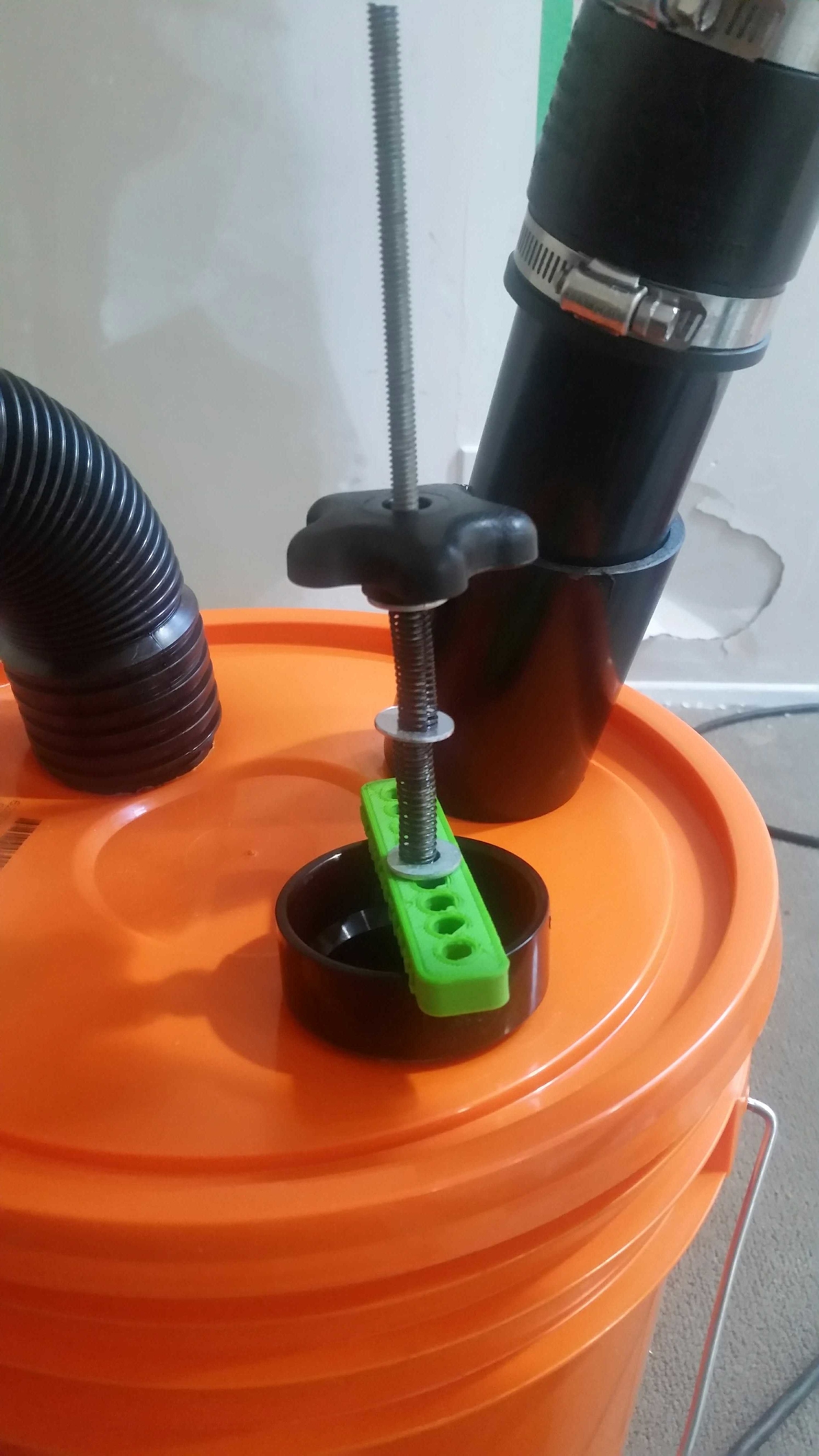 Middle washer allows 2 springs to extend travel range. Catches on threads though.