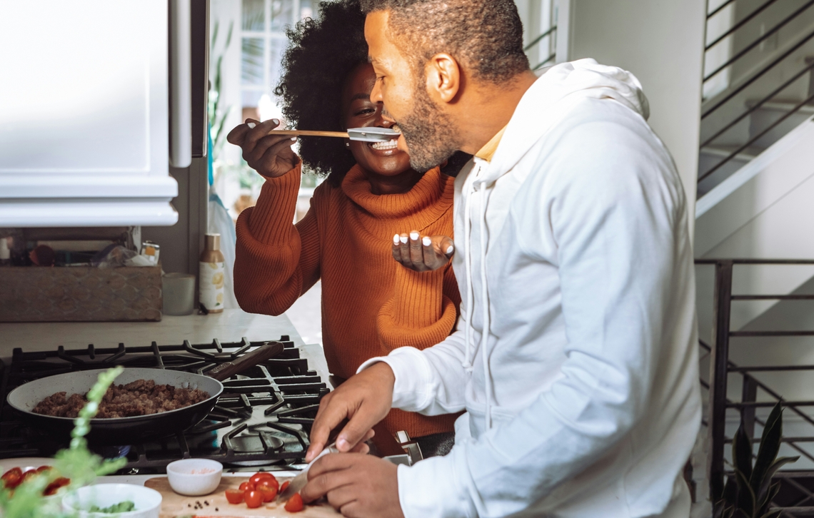 A couple cooking in their kitchen