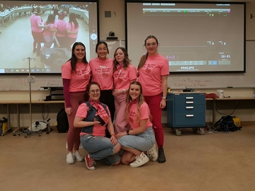 CPR Competition participant group dressed in all pink.