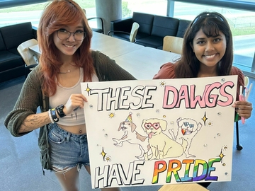 Pride March Poster that reads "These Dawgs Have Pride"