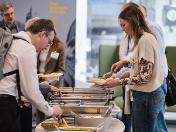 Conference attendees selecting from a buffet