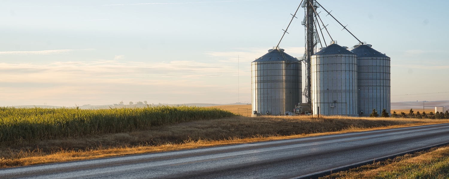 Grain bins along a road